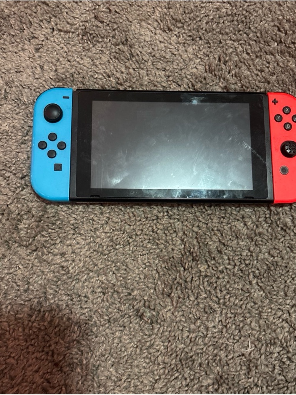 Nintendo Switch with Bright Blue Left and Bright Red Right Joy-Con